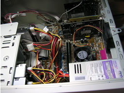 Click for larger image Looking down towards the cards at the bottom of the case. Motherboard covers entire far side of case.