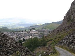 Greyest scene ever! The grey slate piles dominate the grey village. Dull green fields stretch to a horizon obscured by grey cloud.