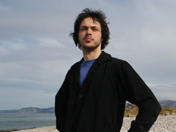 Doing my best outdoors catalogue model pose, framed by the sea and stone defences.