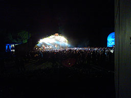 Garden Stage at night. The floodlights illuminate the tightly-knit crowd, perfectly visible from our vantage point.