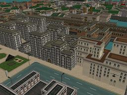 Streetlights at a wide street corner with a planted feature in the foreground. A sprawling apartment complex backed by tightly-packed slums gives way to light industry. Red-bricked factories line a wharf in the background.