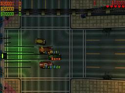 3 players spin their wheels away from the start lights of a race.