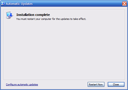 Click for bigger image. Final page of Automatic Updates window says install has completed.
